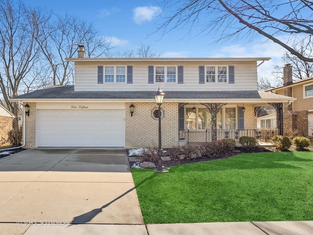 traditional home with driveway, a front yard, a porch, and brick siding