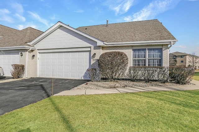 ranch-style house with a front lawn and a garage