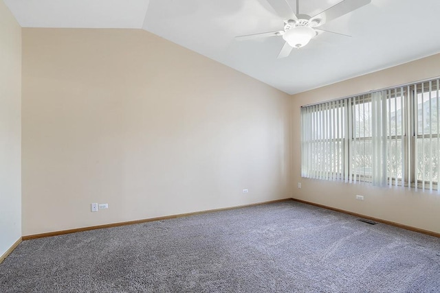 unfurnished room with carpet, vaulted ceiling, and ceiling fan