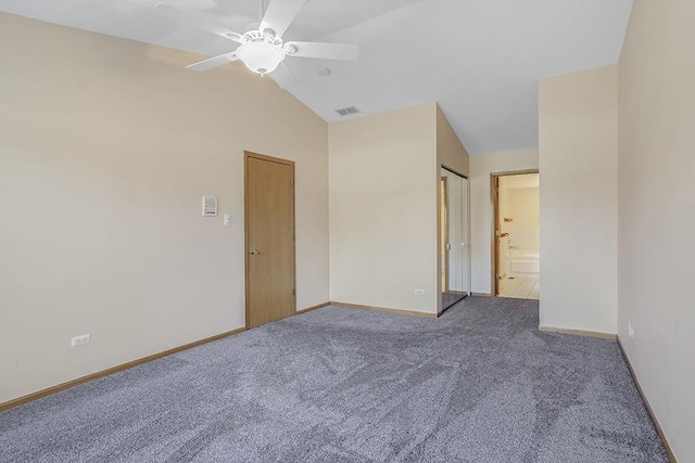 interior space with ceiling fan, carpet flooring, and vaulted ceiling