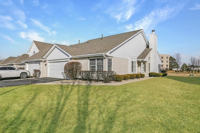 view of property exterior featuring a garage and a yard