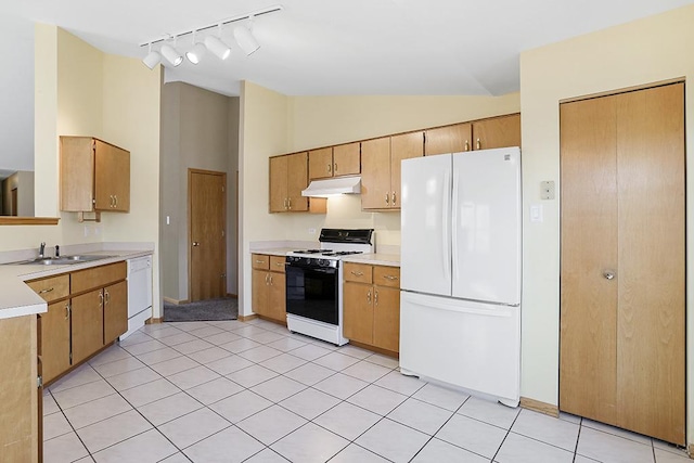 kitchen featuring light tile patterned flooring, sink, white appliances, and high vaulted ceiling