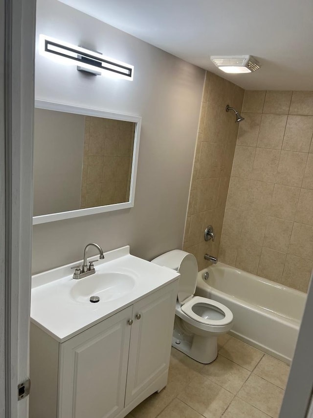 bathroom with tile patterned floors, vanity, toilet, and shower / bathtub combination