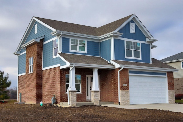 craftsman-style house featuring brick siding, concrete driveway, roof with shingles, a garage, and stone siding