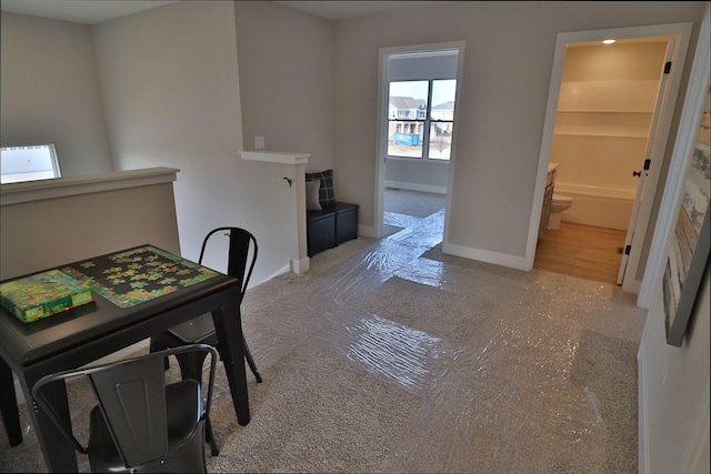 dining room featuring baseboards