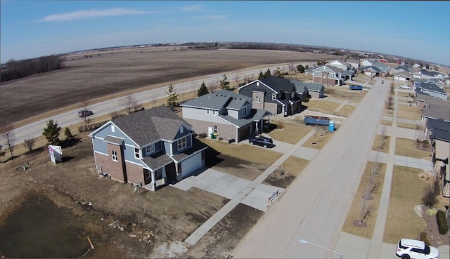 birds eye view of property with a residential view