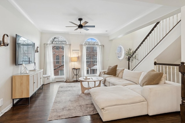 living room featuring crown molding, dark hardwood / wood-style floors, and ceiling fan