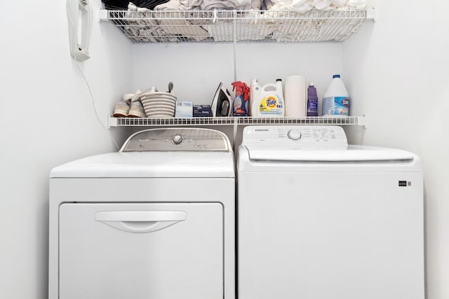 laundry area with independent washer and dryer