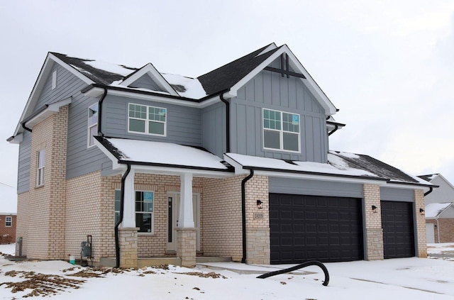 view of front of house featuring a garage and covered porch