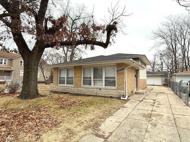 view of front of home with an outbuilding and a garage