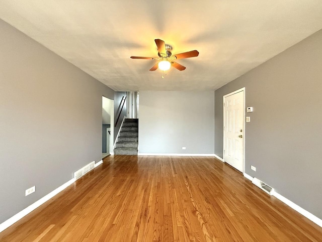 unfurnished living room with hardwood / wood-style flooring and ceiling fan