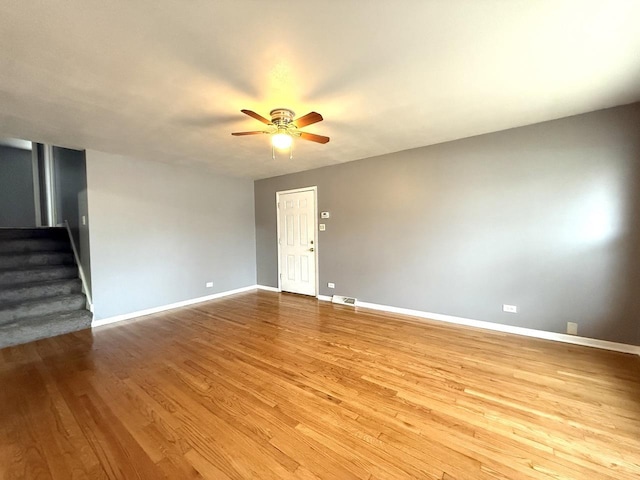 unfurnished room featuring light hardwood / wood-style flooring and ceiling fan