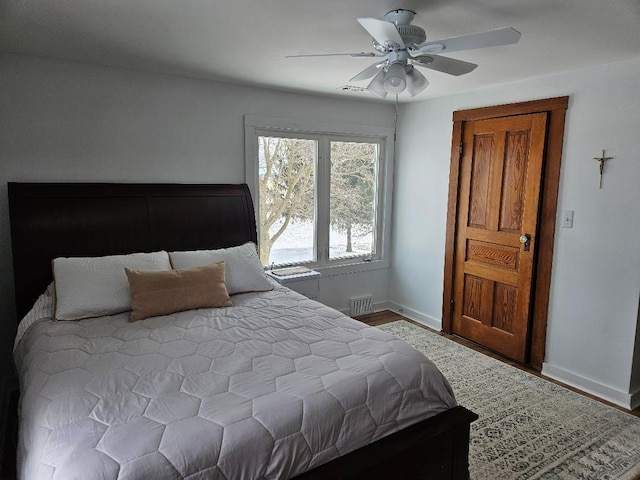 bedroom featuring hardwood / wood-style floors and ceiling fan