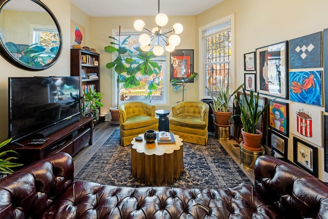 living area featuring wood-type flooring and a chandelier