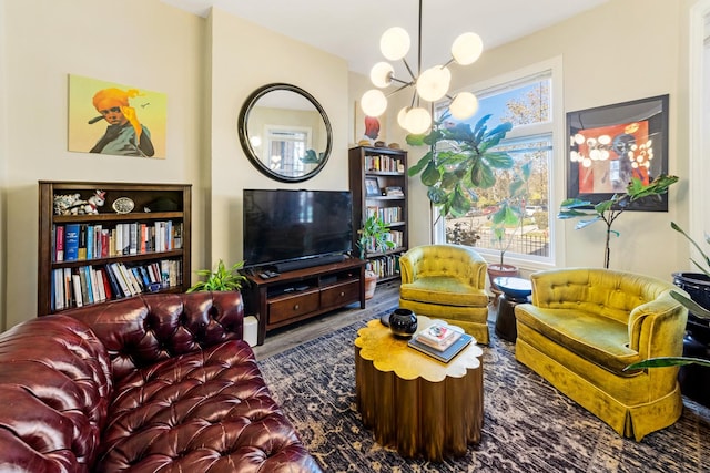 living room with an inviting chandelier, hardwood / wood-style floors, and a wealth of natural light