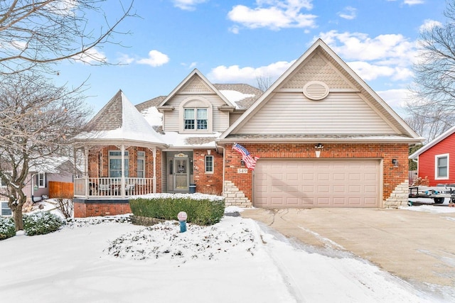 view of front of house with a porch and a garage