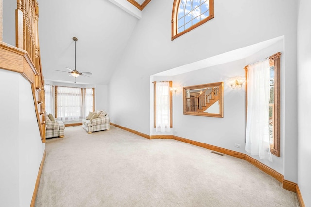 549 Beachview Dr, Lake Holiday, IL 60552 - unfurnished room featuring visible vents, baseboards, ceiling fan, high vaulted ceiling, and carpet