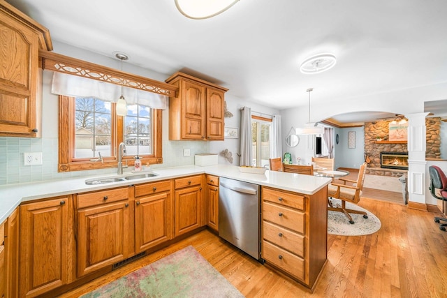 549 Beachview Dr, Lake Holiday, IL 60552 - kitchen with hanging light fixtures, a sink, light countertops, a peninsula, and stainless steel dishwasher
