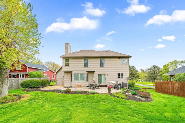 549 Beachview Dr, Lake Holiday, IL 60552 - back of property with fence, central AC unit, a chimney, a patio, and a yard