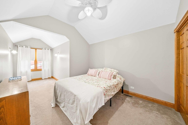 549 Beachview Dr, Lake Holiday, IL 60552 - bedroom with ceiling fan, visible vents, baseboards, lofted ceiling, and light carpet