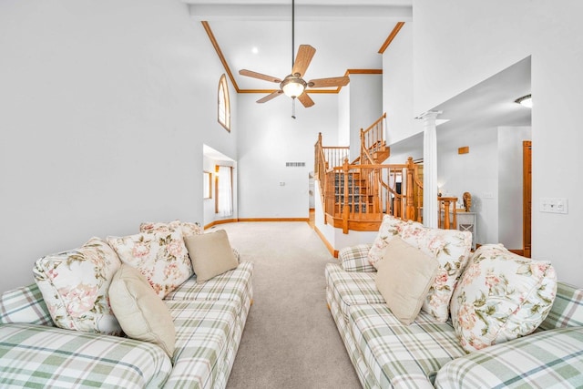 549 Beachview Dr, Lake Holiday, IL 60552 - living room with a ceiling fan, high vaulted ceiling, carpet floors, ornate columns, and stairs