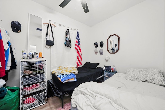 bedroom featuring hardwood / wood-style floors and ceiling fan