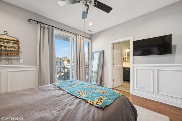 bedroom with ceiling fan, ensuite bathroom, and light wood-type flooring