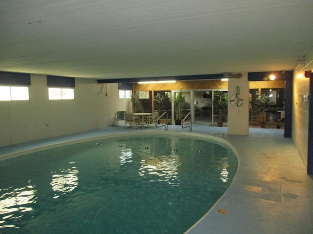 indoor pool with a patio area