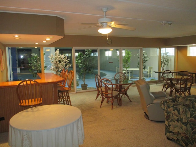 sunroom featuring ceiling fan