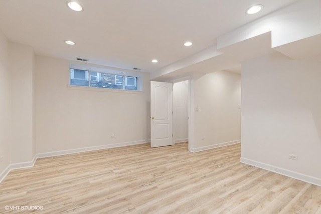 basement featuring recessed lighting, visible vents, light wood-style flooring, and baseboards