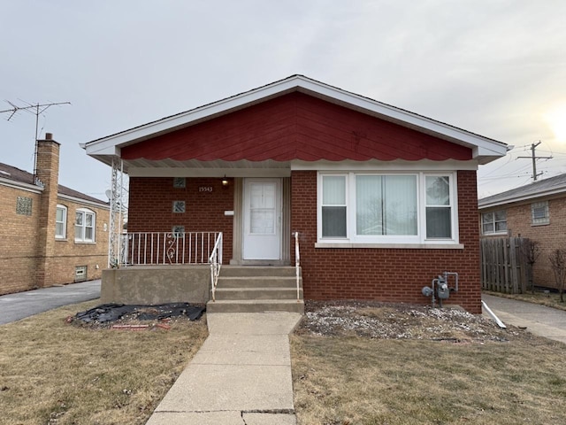 bungalow featuring a porch and a front yard