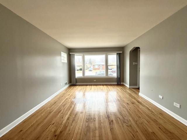 spare room with light hardwood / wood-style floors