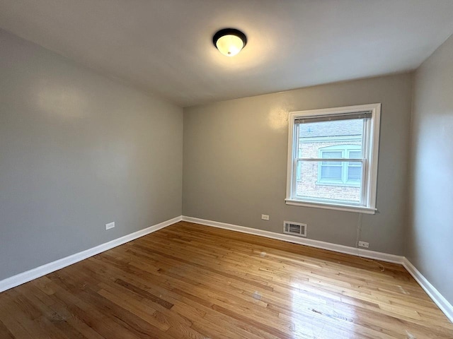 empty room with light hardwood / wood-style floors