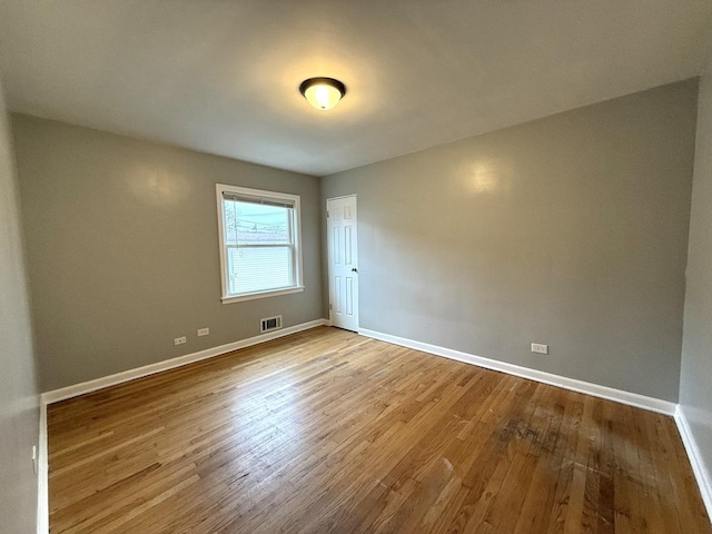 unfurnished room featuring light wood-type flooring