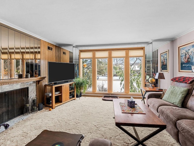 carpeted living room featuring crown molding