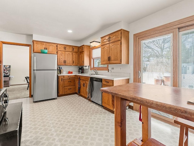 kitchen with appliances with stainless steel finishes and sink