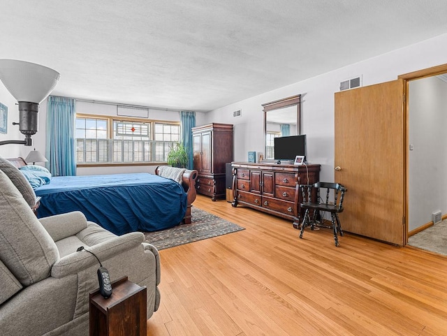 bedroom with light wood-type flooring