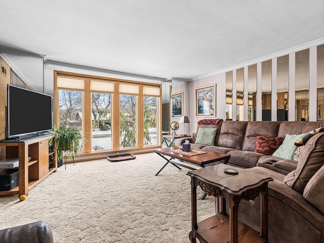 living room featuring crown molding and carpet flooring