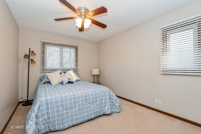 bedroom with carpet floors, ceiling fan, and baseboards