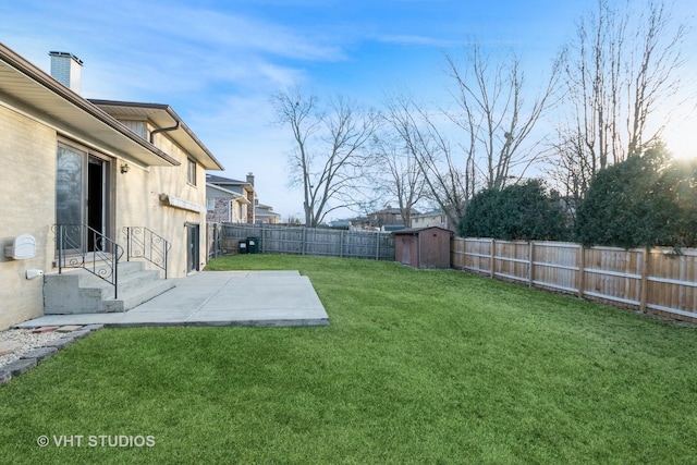 view of yard featuring a storage shed, a fenced backyard, a patio area, and an outdoor structure