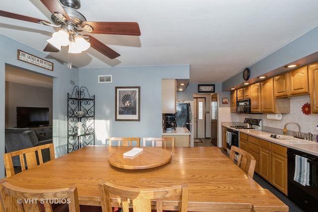 dining area with visible vents and a ceiling fan