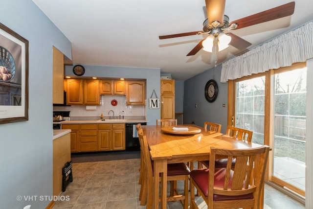 dining space featuring dark tile patterned floors and ceiling fan