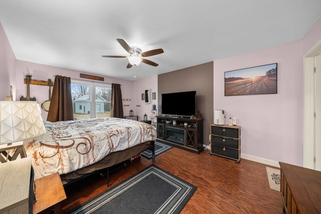 bedroom featuring dark hardwood / wood-style floors and ceiling fan