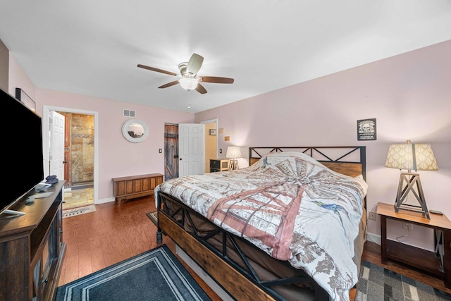 bedroom with dark hardwood / wood-style floors and ceiling fan