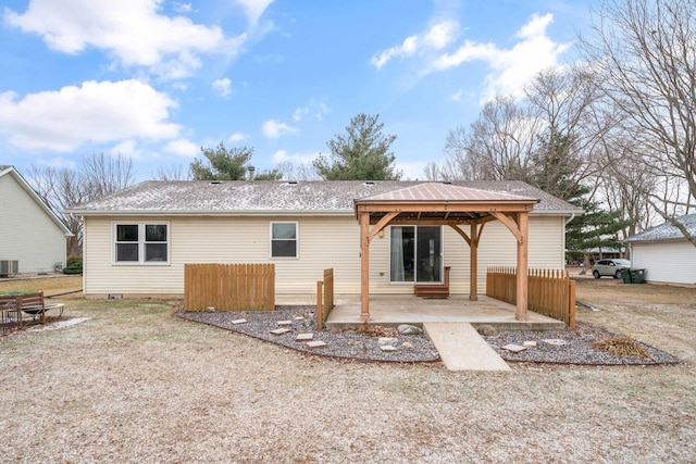 back of property with a gazebo, central AC unit, and a patio