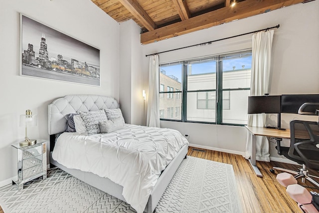 bedroom with wood ceiling, lofted ceiling with beams, and light wood-type flooring