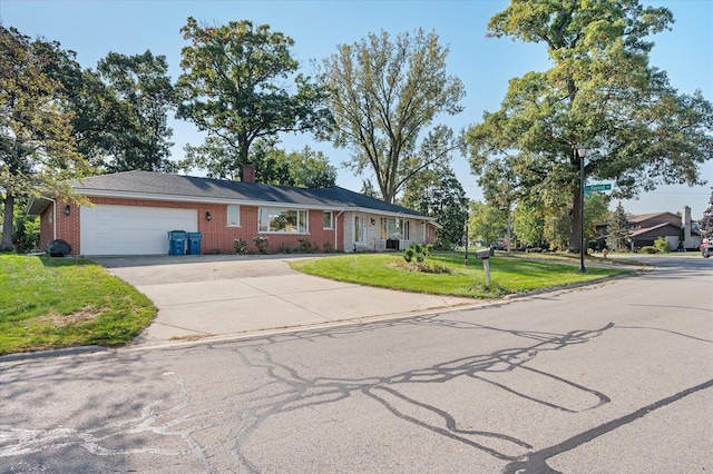 ranch-style house with a garage and a front yard