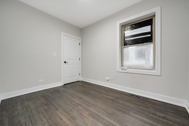 empty room featuring dark hardwood / wood-style floors