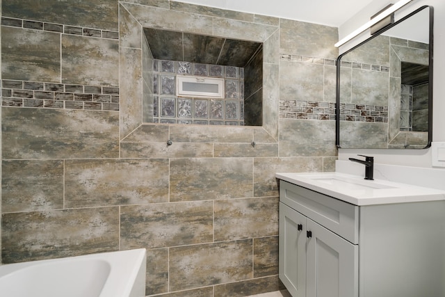 bathroom featuring vanity and tile walls