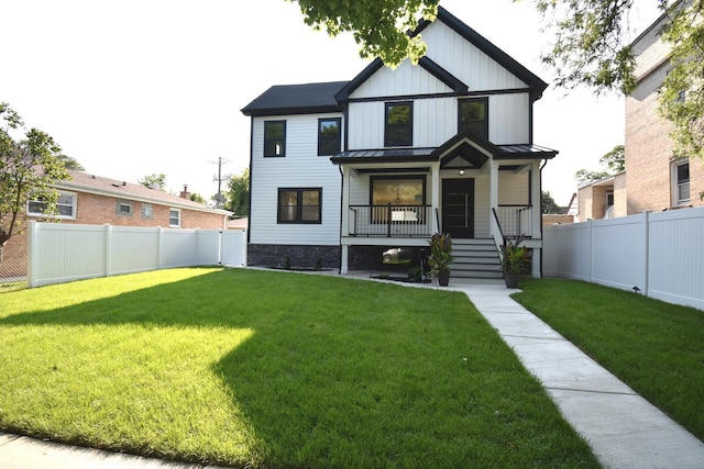 view of front of house with a porch and a front yard